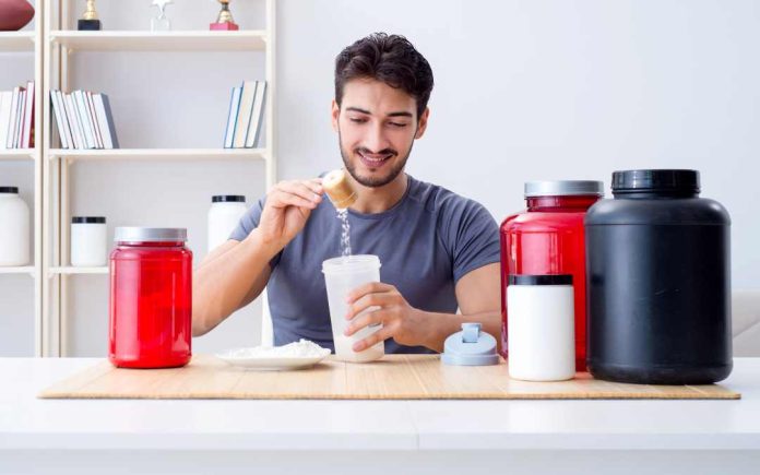 A man preparing a whey protein shake